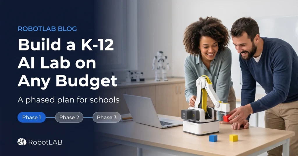 Two educators programming a Dobot Magician Lite robotic arm to stack blocks in a K-12 classroom